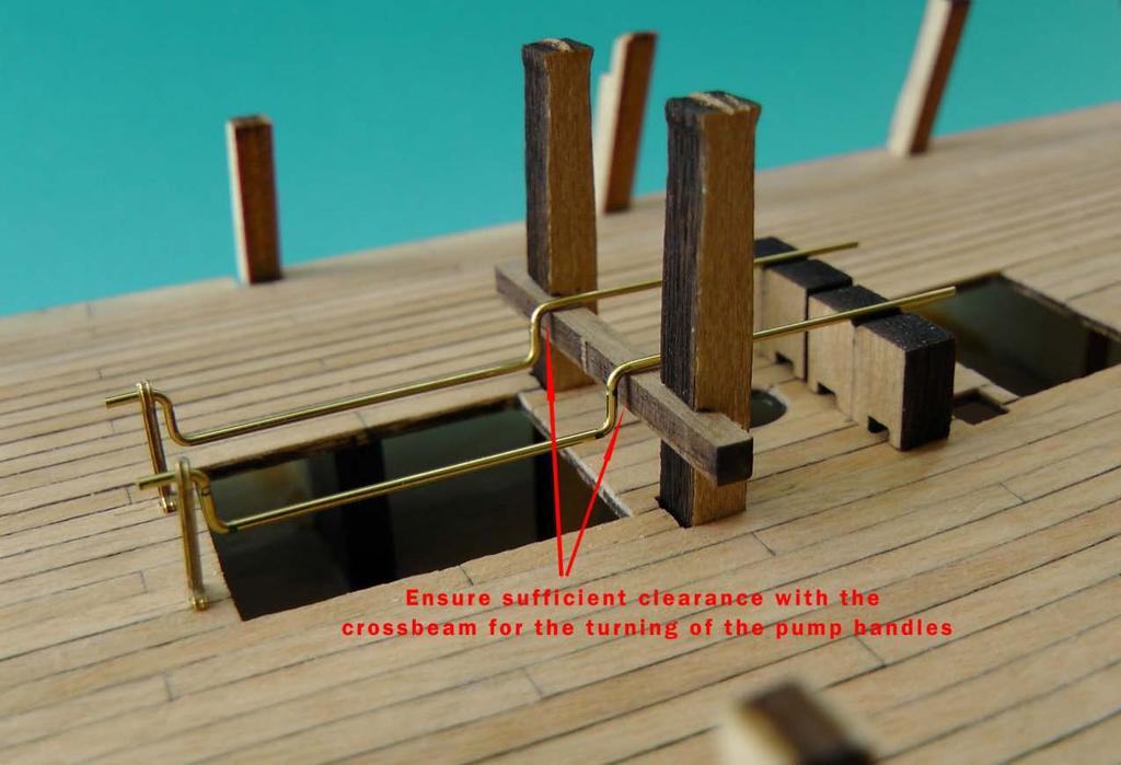 Figure H27 - Pump handles sit above the cross beam between the bitts The position of the gun deck is marked on the bitts by pushing a chisel craft knife, creating a very fine line on the