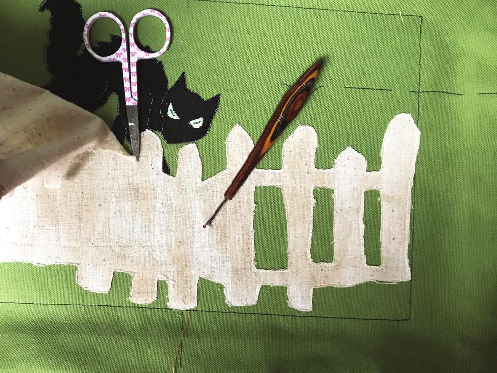 Although the cat/fence design must be embroidered first, the order in which the remaining two designs are stitched is immaterial.