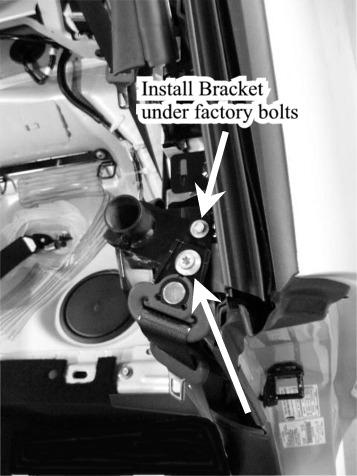 b) Install the Sport Bar Bracket to the vehicle using the factory bolts removed in the above step. Torque seat belt guide bolt (T-50 Torx) to 30lb-ft.