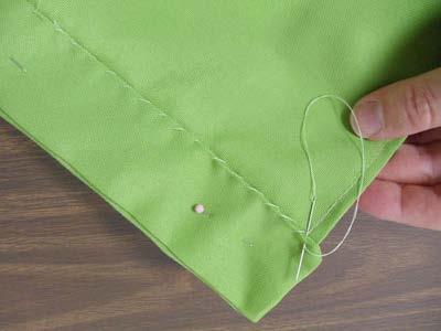 Sew through the bottom edge of the fold and the back fabric only.