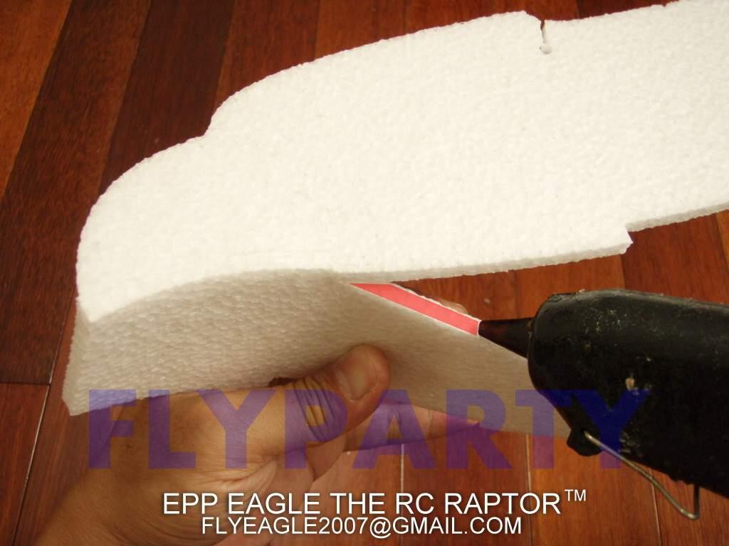 Step 10: Apply glue to the side of the bottom fuselage for the eagle