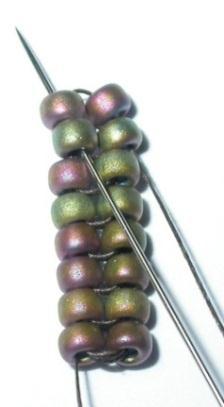 String 2(K), pass down through the top bead on the