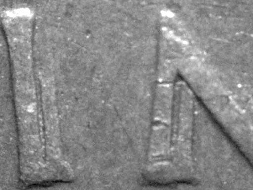 Paul M Holland Figure 2. Close-up photographs showing doubling of INA in REGINA in the obverse legend of a 1953 halfpenny.