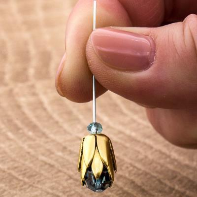 making one unit: 1 8mm Indicolite Crystal round bead 2 8mm antique gold