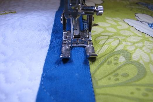 Add to the end of the previous unit. Finish sewing the seam between Blocks 7 and 9, including Block 10 in the seam. Seam the upper unit to the lower unit.
