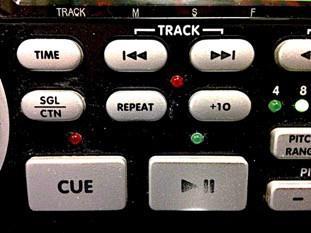 The other button you need to know is the Play/Pause, Previous track/ Next track, and the SGL/CTN button. SGL/CTN stands for Single/Continuous.