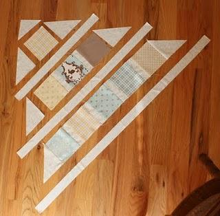 When sewing a corner-setting triangle to the end of a row, center the longest side of the triangle with both points hanging over the corners of the matched-up square. Sew right sides together.