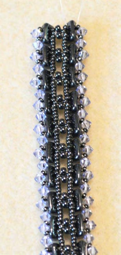 the next set of 3 beads sewn to the back of the next T bead.