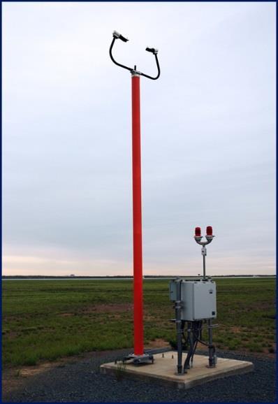 one of the two lamp enclosures comprising a REIL system installed next to the runway threshold.