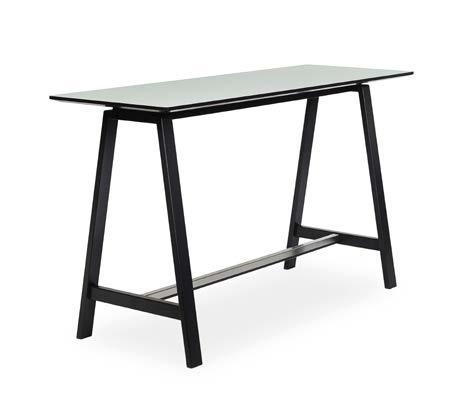 Simple yet full of character, its 30 mm table top seems to float above the two solid wood trestles.