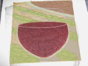 See Photo D Place the wine appliqué fabric, aligning it with the guide