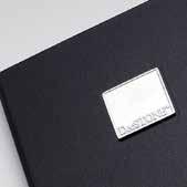 Leather tabs embossed with silver logo applied to a magnetic catch, providing a soft close and tasteful branding.