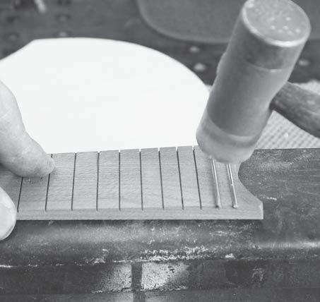 We like cutting the wide end of the fingerboard to make it more interesting, but you can leave it square. Figure 34 shows some other options that are common for mandolin fingerboards.