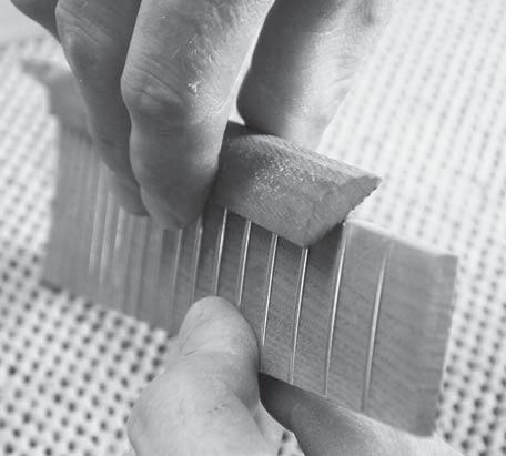 Put a bevel on the ends of the frets by tilting your file to a 45 degree angle, as shown in fig 37.