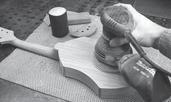 FINAL SANDING 59. There may be some large areas of the instrument, such as the soundboard and back, that need a quick sanding with a power tool.