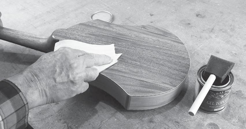 If the sandpaper loads up with gunk as you sand, then the finish is not dry! Give it more time.