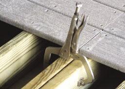 Align the corners and top of the joists, then use vise clamps to hold the