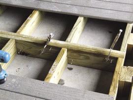 of the wood up. Use 2" screws to fasten boards to the joist.