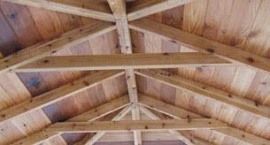Using three 2 1/2" screws on each side, fasten the ceiling ties onto the rafter generally