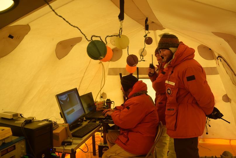 Engineers and scientists monitoring Icefin as it swims.