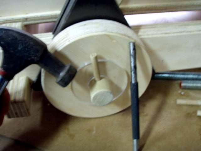 punch and hammer to push a smaller dowel into place.