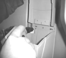 Install toilet paper dispenser: drill out dimples (3) located on inside of unit in