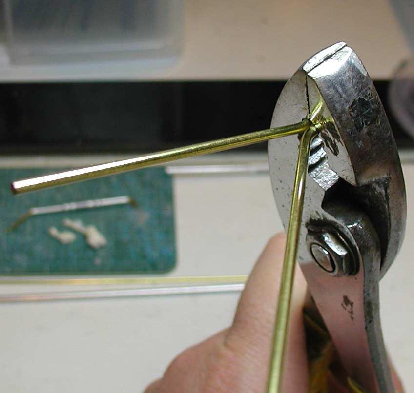 Using a nail or other fixed guide, fully bend the 0.