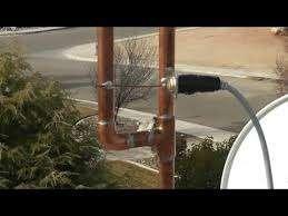 Pole above consists of some pipe, a copper T, a copper L, and a couple copper pipe caps. Standard plumbing flux, solder, a propane torch, and a hack saw are all that are needed to assemble it.