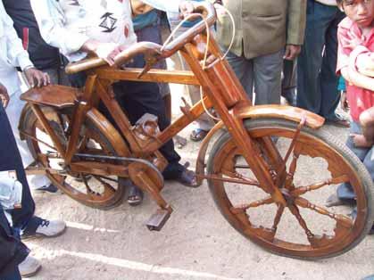 The innovator has modified the chain and sprocket system slightly to suit his wooden needs.