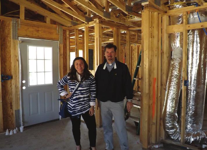 DONOR SPOTLIGHT The Anonymous Donor Left to Right: Director of Development, Elizabeth Paul, and Executive Director, John Rhoden, pause during a tour of construction; Future homeowner, Tacora Wine,