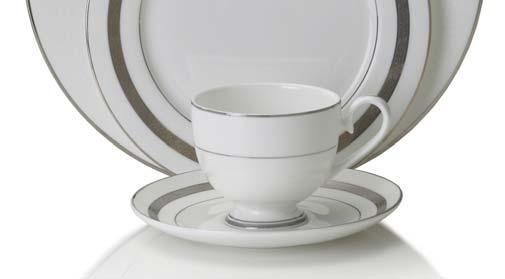 The five-piece place setting includes a dinner plate, a salad plate, a bread and butter plate, a tea cup and a saucer