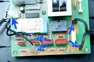 Note how the small connector s wires are routed so as not to confuse it with the Main Fan s connector. Remove the screws that secure the main board to the base (17).
