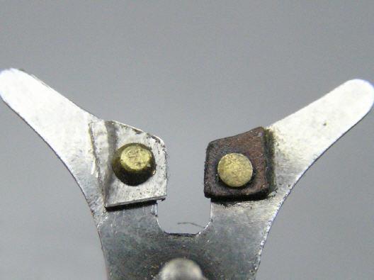 It contrasts with the normal flat head rivet.