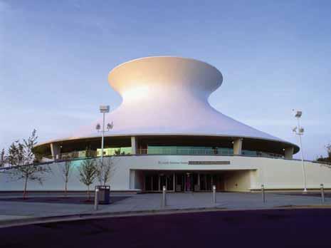 The St. Louis Science Centre Planetarium's exterior curved surface is in the shape of a hyperboloid of revolution. This shape is formed by revolving a hyperbola around its axis.