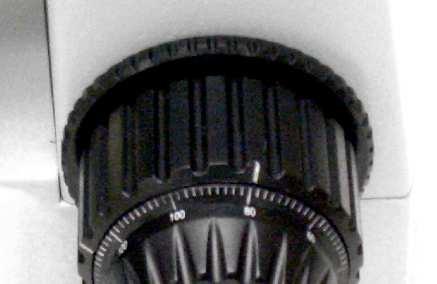 The larger knob is typically for the coarse focusing and the smaller knob for the fine focusing. The smaller knob is usually centered on the inside of the larger one.