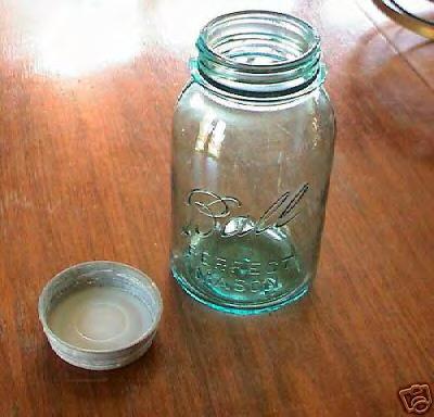 Figure 16a: Zinc mason jar cap with milk glass insert discovered in Level 5, Subunit 2. The glass has GENUINE ZINC CAP FOR BALL MASON JARS embossed on the exterior.