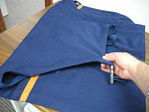 Lay the straps inside the apron and fold the top