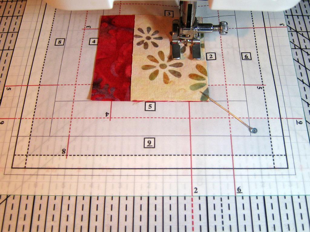 . Align the long extended red solid line with the red sewing line on the Seam Guide.