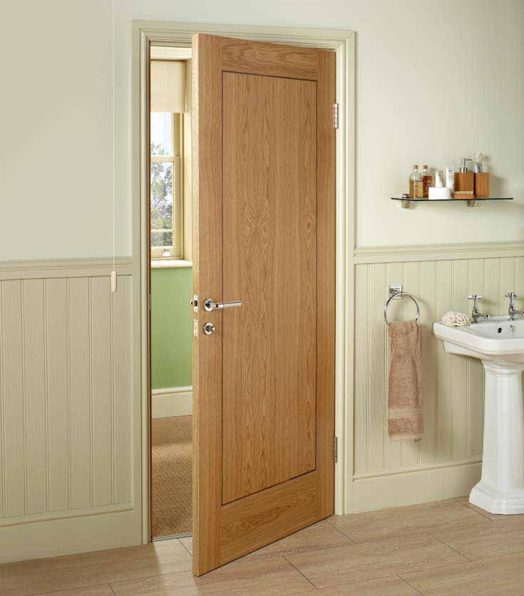 1 Panel Inlaid Oak Veneer This flush door design is faced with panel effect veneers, inlaid with real walnut. Shown with Tongue & Groove Wall Panelling.