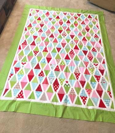 Line up the strip to your trimed quilt on top side. Sew the top first. Cut sash when you come to the end. Now sew on the bottom strip.