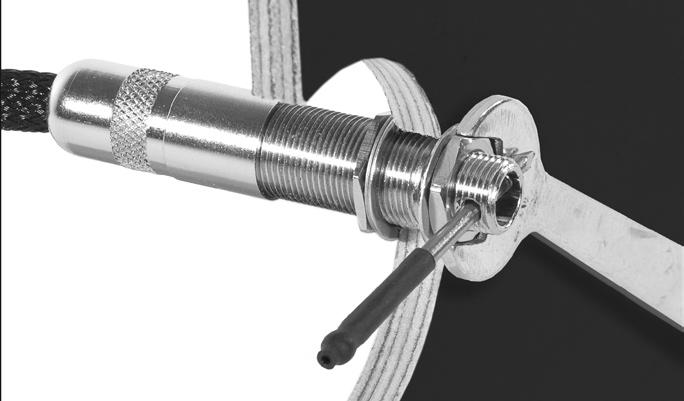 Place the ½" wrench on the retaining nut. Insert the jack-tightening pin through the cross-drilled hole in the threads of the jack.