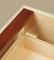 Drawer bottoms are nominal 1/4" (6mm) multi-ply hardwood inserted into dado in front, back and sides. Drawer bottoms are glued and stapled to sides.