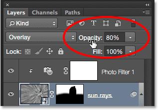 The Opacity option is found in the upper right of the Layers panel, directly across from the Blend