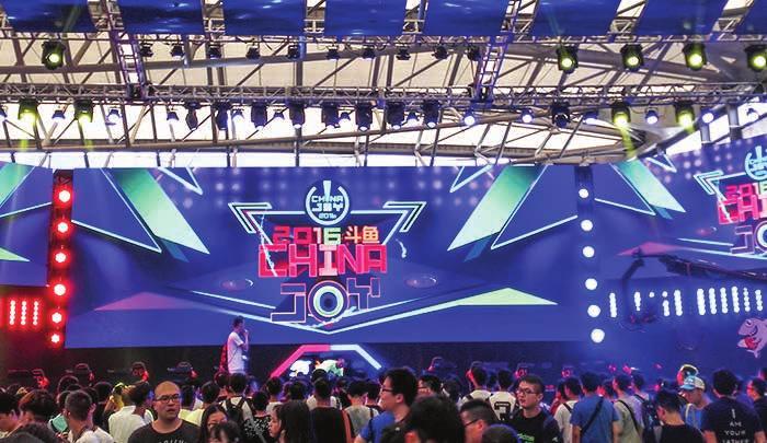 esports: A paradigm shift for Asia s gaming industry People visit the stand of Chinese game video streaming platform Douyu, during the 14th China Digital Entertainment Expo and Conference, also known
