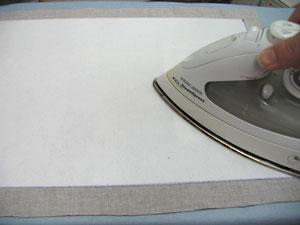 Then, flip it over and align the interfacing with the marked shape on the right side of the fabric.