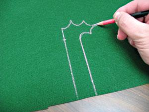 To create the flag, draw a 1 inch wide by 5 inch long rectangle on the stiff felt. Then, draw or trace any shape you like off to one side of one of the ends of the rectangle.