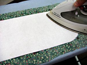 Lay the interfacing on top of a piece of the print cotton fabric with the fusible side of the interfacing facing the