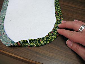 Spray the wrong side of the fabric with temporary adhesive, wrap