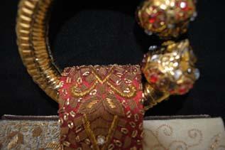 an exclusive jewel of a bag in itself BAROQUE Intricate brass