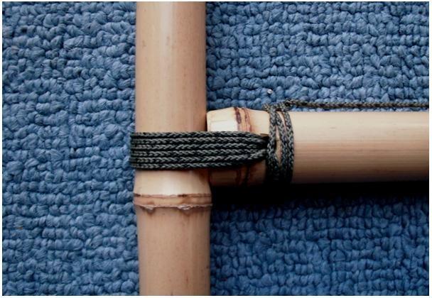 The drilled joint can also be used to connect the end of a cross-pole to an upright, as shown here. For this application, the lashings should be tied above a node on the upright.